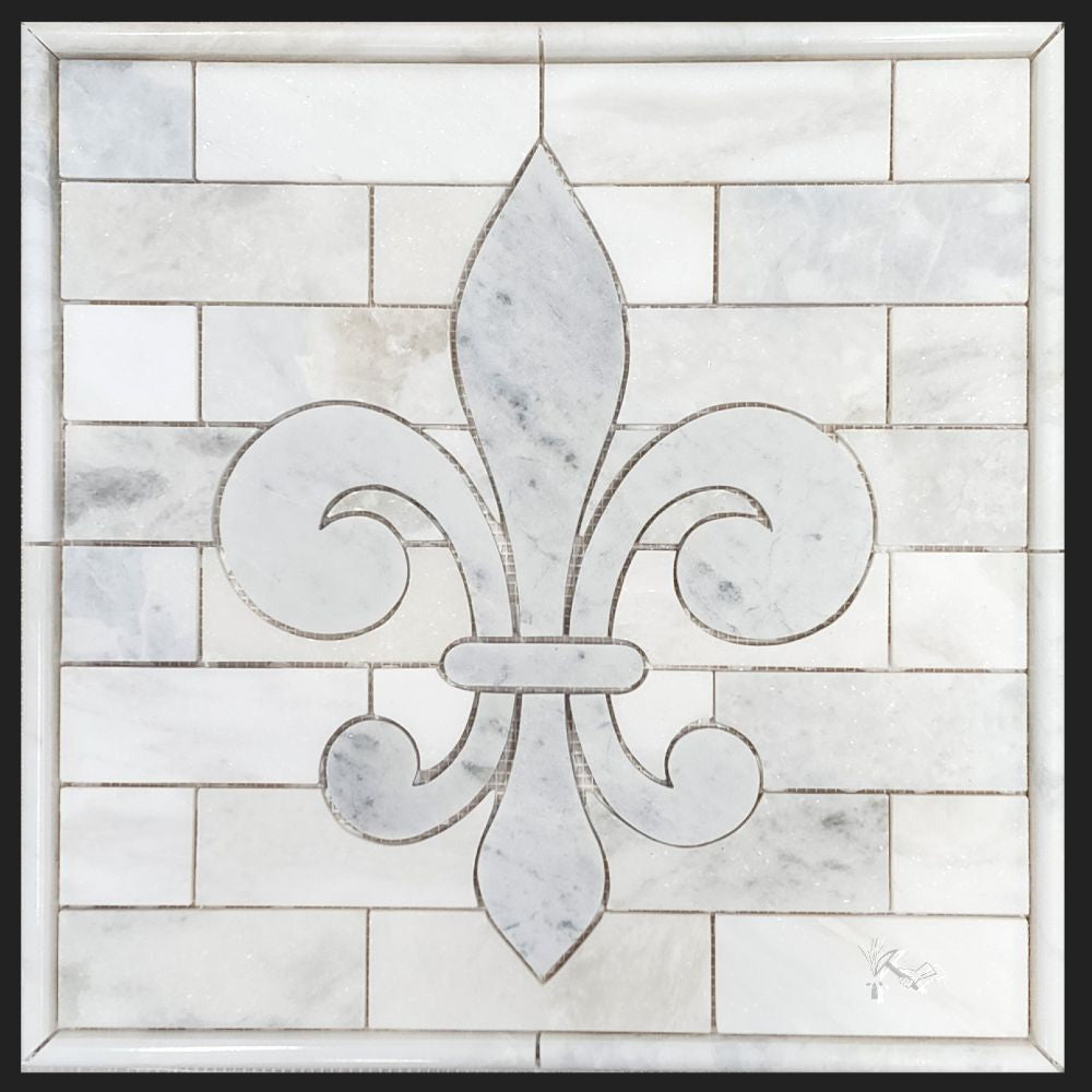 Fleur de Lis Backsplash Medallion made from greyish white Blue Forest Marble tile with polished Sahara Carrara marble tile surrounding it.