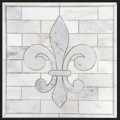 Fleur de Lis Backsplash Medallion made from greyish white Blue Forest Marble tile with polished Sahara Carrara marble tile surrounding it.