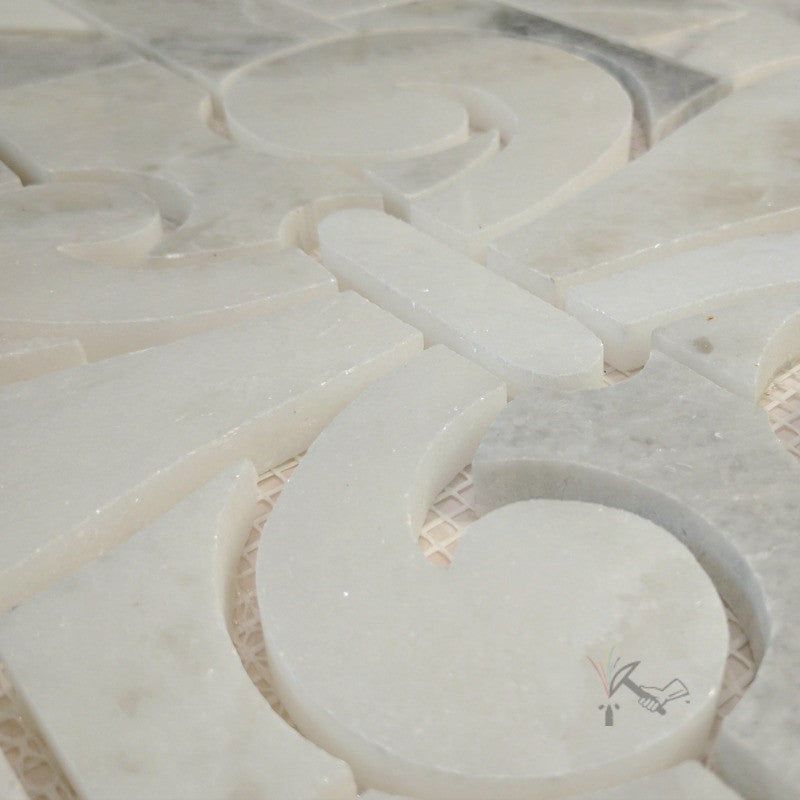 Closeup of Fleur de Lis Backsplash made from Sahara Carrara Marble.