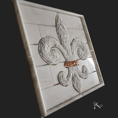 A Fleur de Lis Tile Insert or Medallion made from highly textured and hand cut marble and glass.