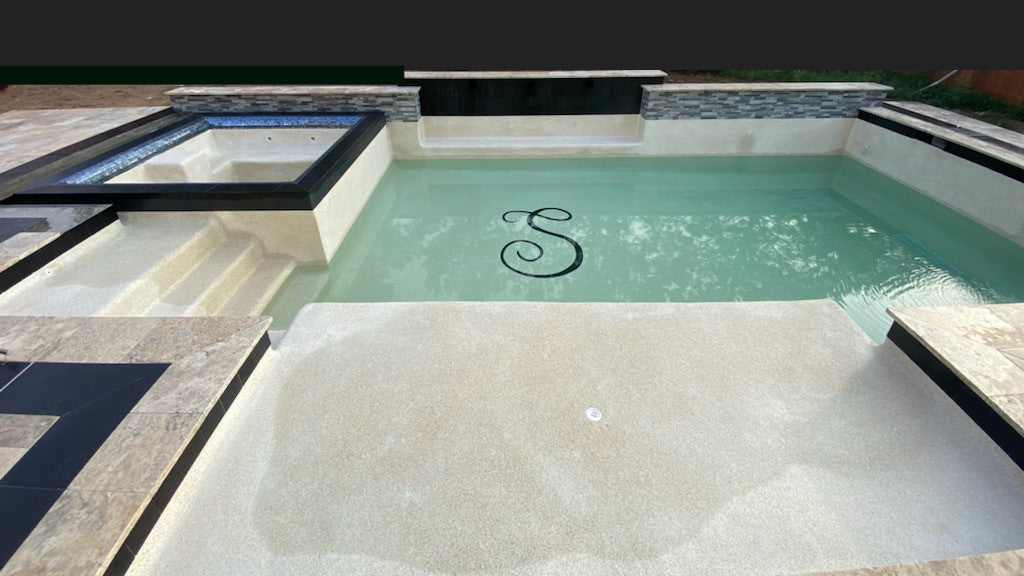 Custom Letter installation inside swimming pool.  This is a monogram S.